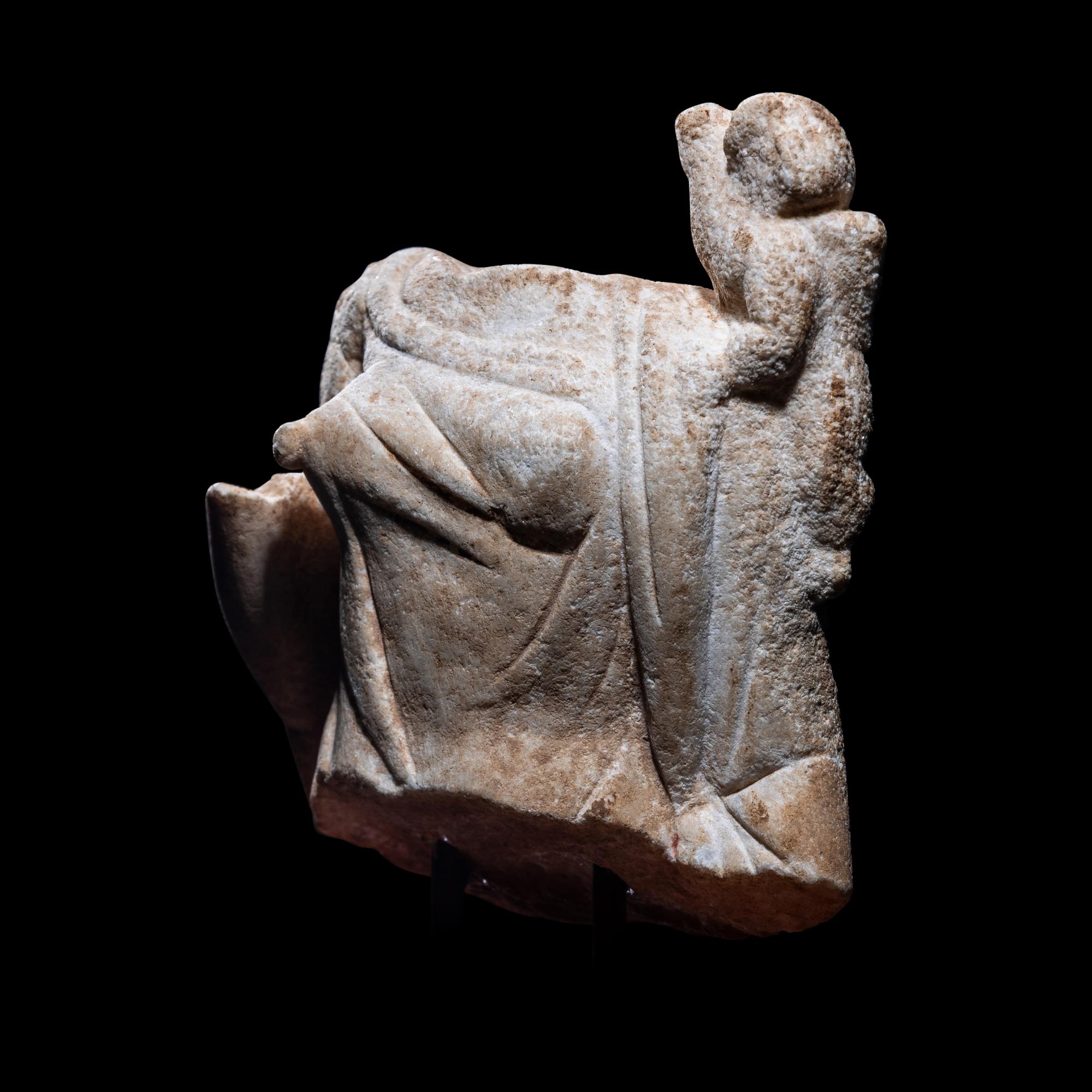 A Roman Marble Fragment of Venus with Eros