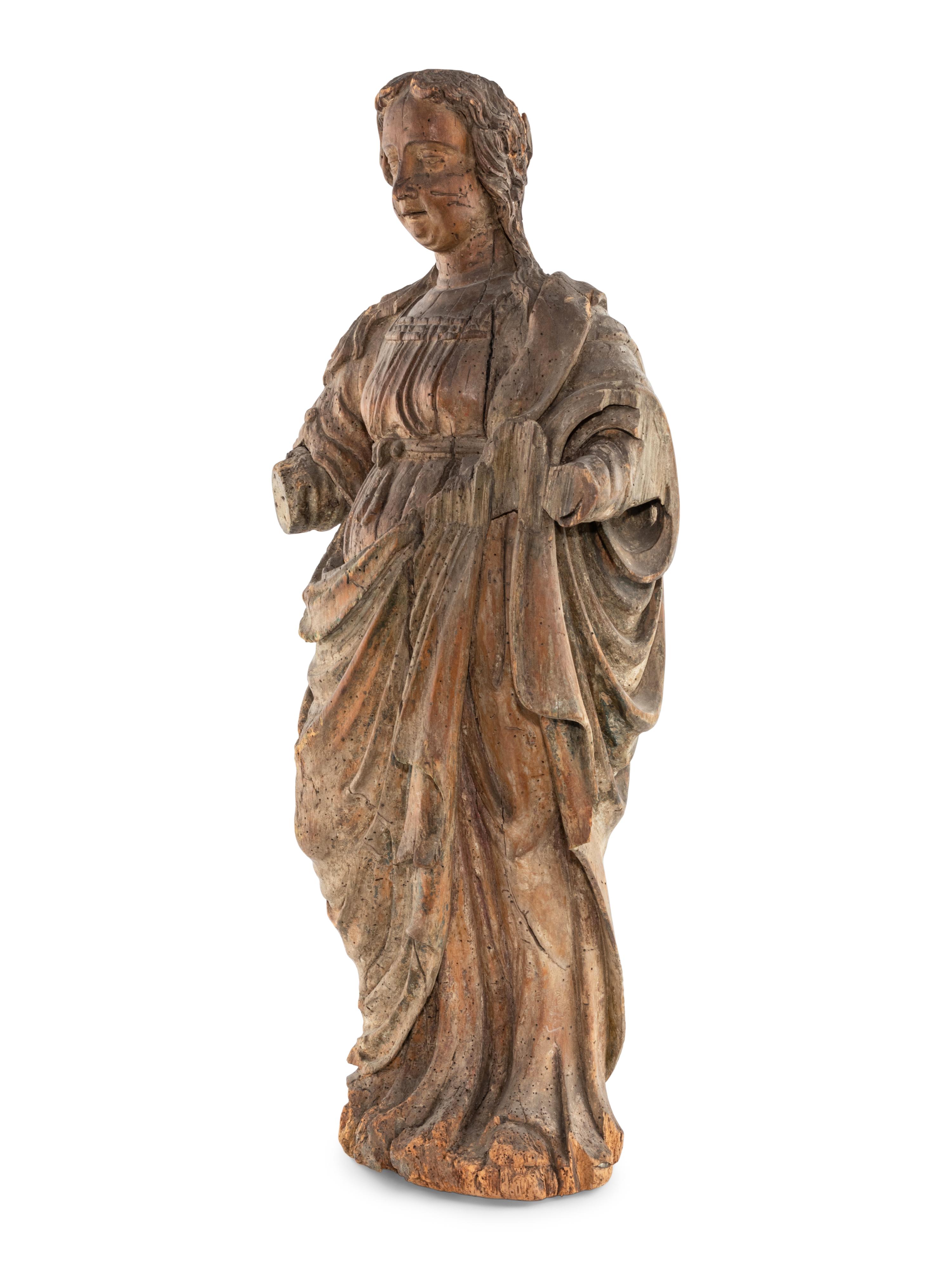 A Continental Carved and Painted Wood Figure of St. Mary