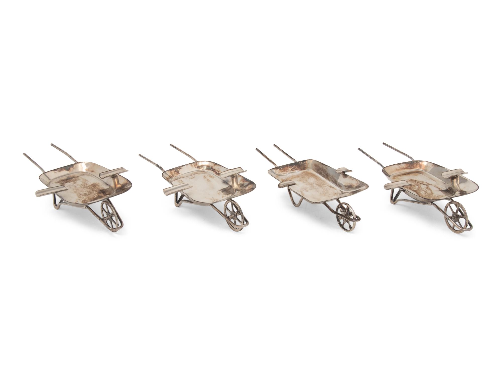 An Assembled Set of Four Mexican Silver Wheelbarrow-Form Ash Trays