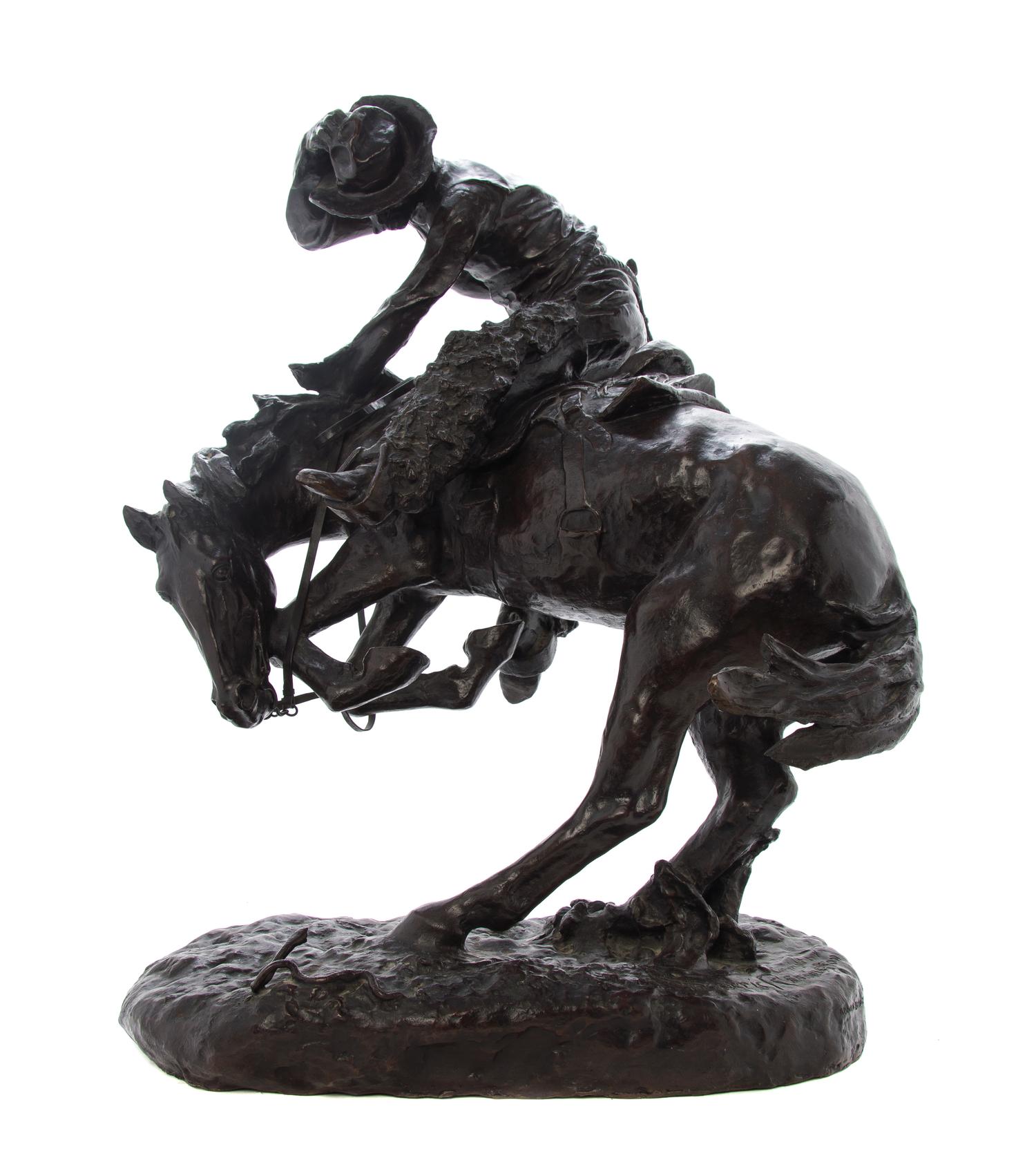 An American Bronze Figural Group, after Frederic Sackrider Remington (1861-1909), Height overall 23 inches.