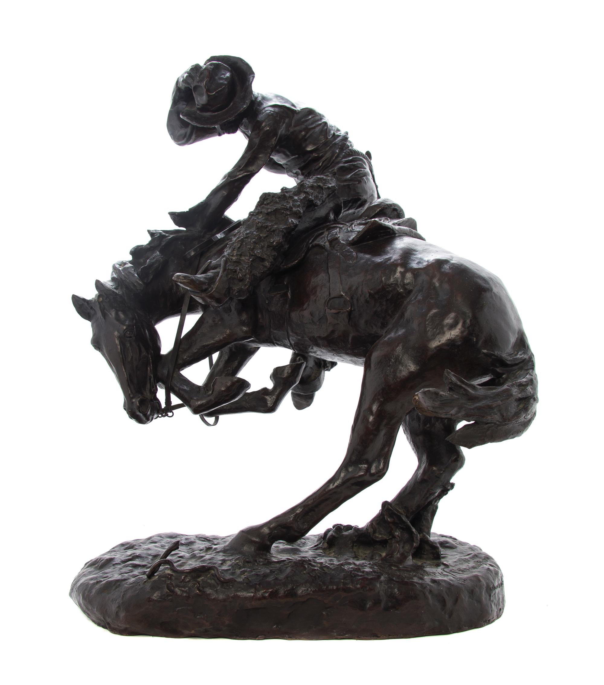 An American Bronze Figural Group, after Frederic Sackrider Remington (1861-1909), Height overall 23 inches.