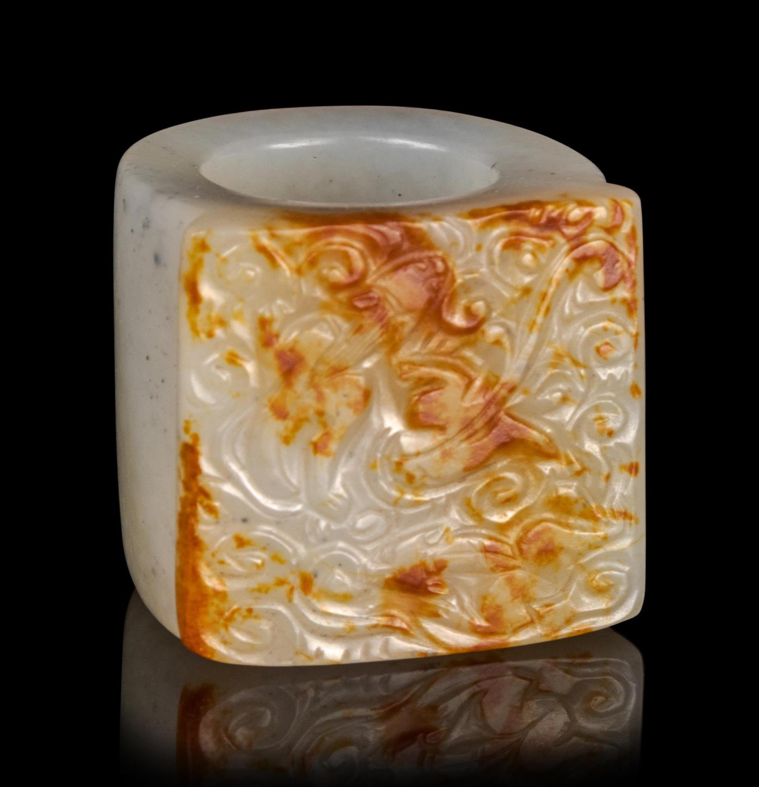 A Russet and White Jade Archer's Ring