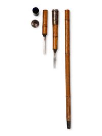 An Edwardian Silver Mounted and Pyrographic Decorated Officer's Campaign Mess-Kit 'System' Walking Stick