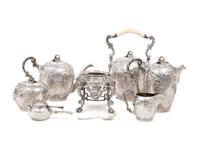 A Rare German Silver Two-Tier Tea Table with Matching Five-Piece Tea Service and Two Trays
