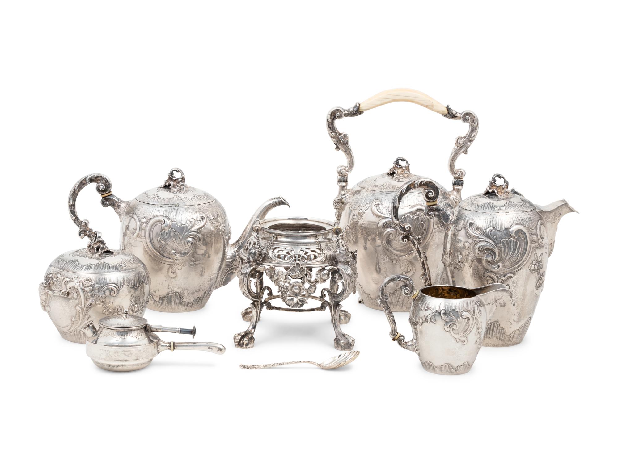 A Rare German Silver Two-Tier Tea Table with Matching Five-Piece Tea Service and Two Trays