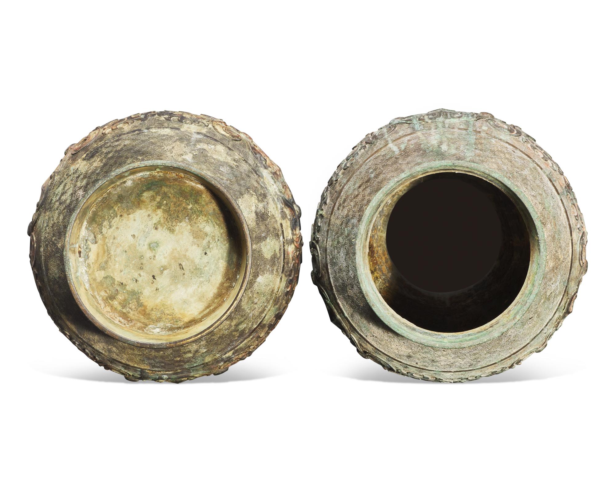 A pair of patinated bronze archaistic large vases