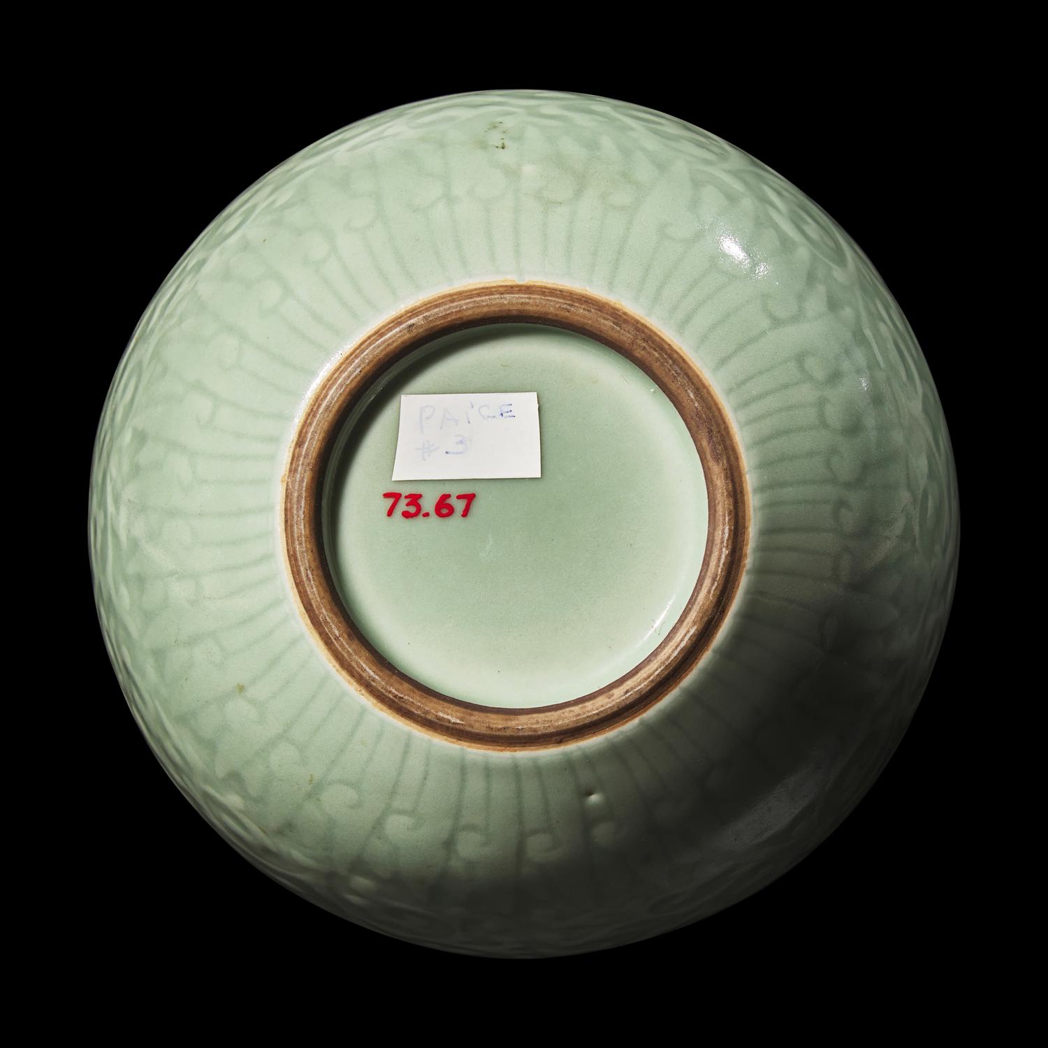 A Chinese Celadon Glazed Molded Porcelain Bottle Vase, Late Qing Dynasty 清晚期 粉青釉龍紋天球瓶