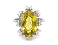 An 18 Karat White Gold, Chrysoberyl and Diamond Ring, 7.80 dwts.
