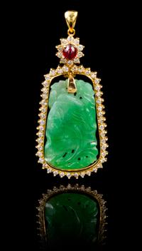 A Jadeite, 18 Karat Gold and Diamond Pendant Height 2 inches.