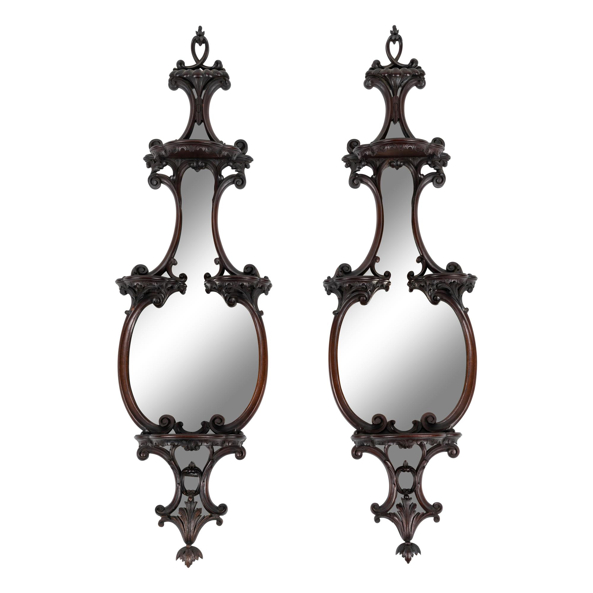 A Pair of George III Style Mirrored and Carved Mahogany Wall Brackets