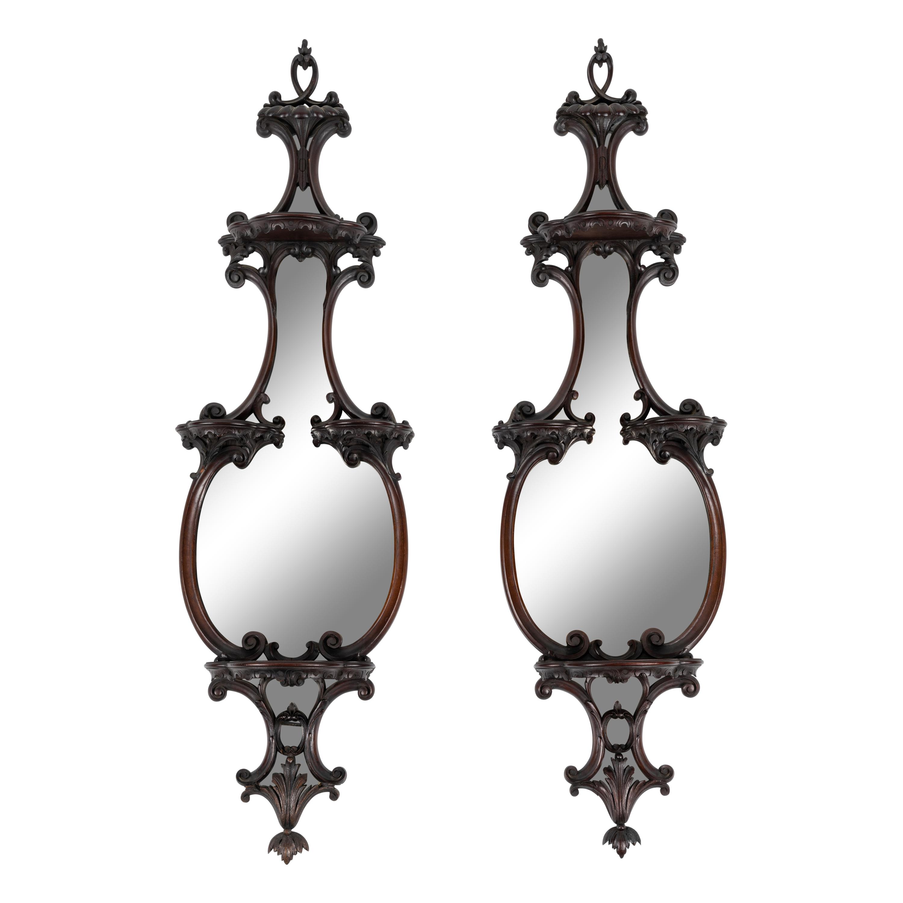 A Pair of George III Style Mirrored and Carved Mahogany Wall Brackets