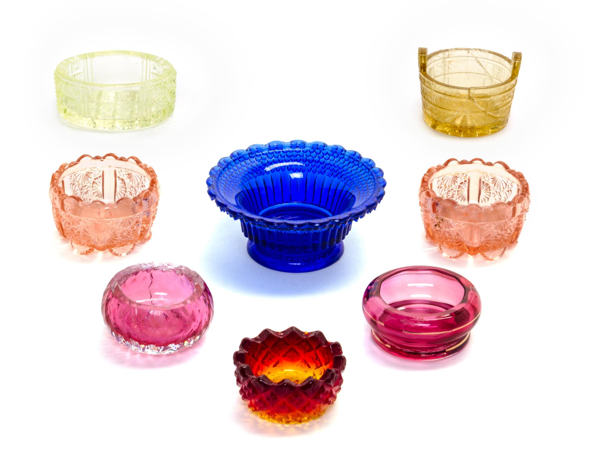 A Collection of Cut and Molded Glass Salts Diameter of largest 3 1/8 inches.