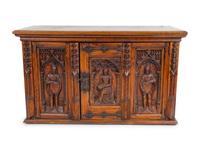 A Renaissance Revival Carved Oak Trunk with Iron Mounts — 19TH/20TH CENTURY