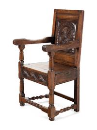 A William and Mary Carved Oak Open Armchair