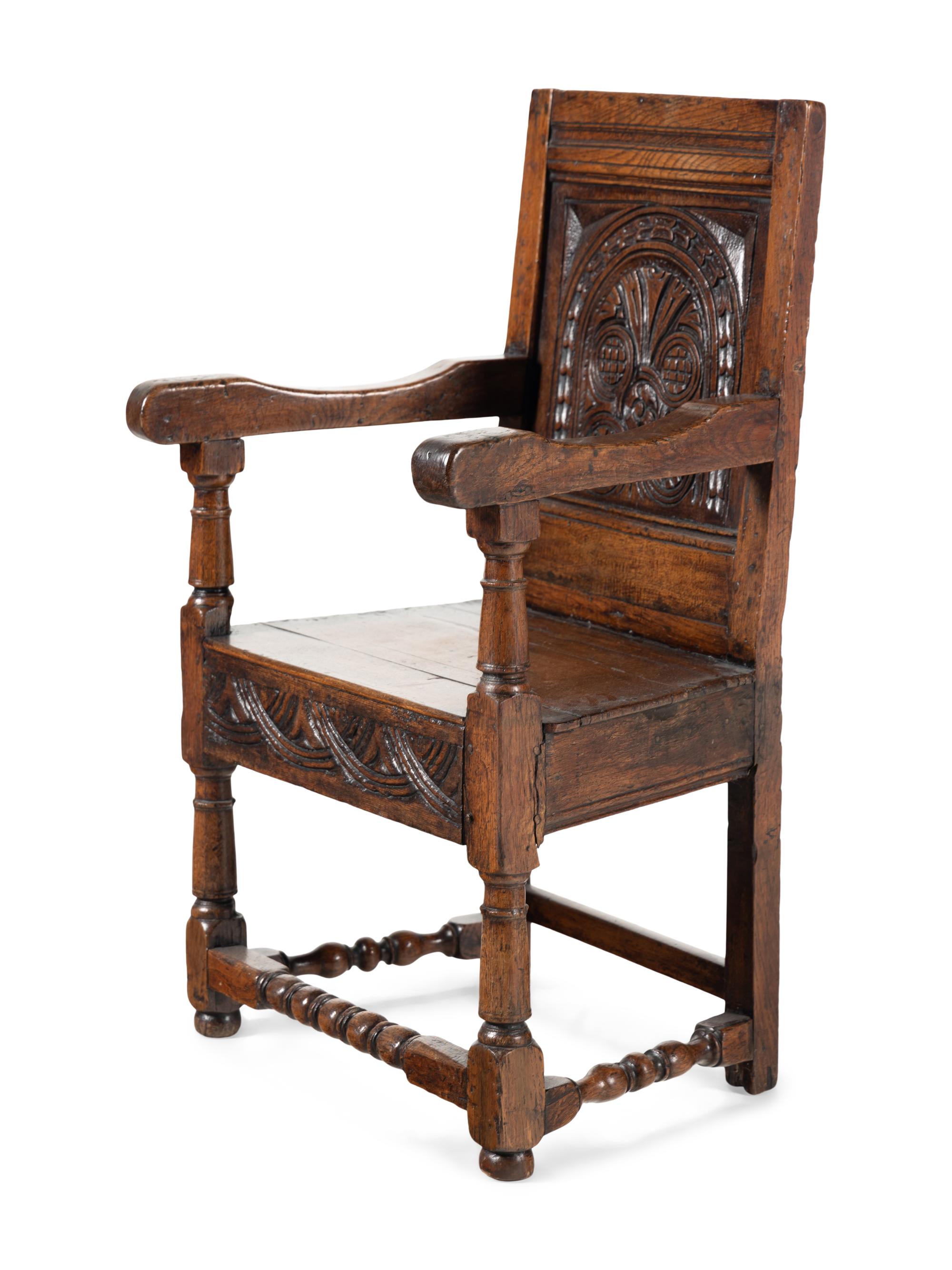 A William and Mary Carved Oak Open Armchair