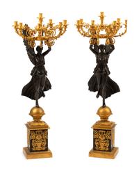 A Pair of Monumental Empire Style Gilt and Patinated Metal Seven-Light Figural Candelabra