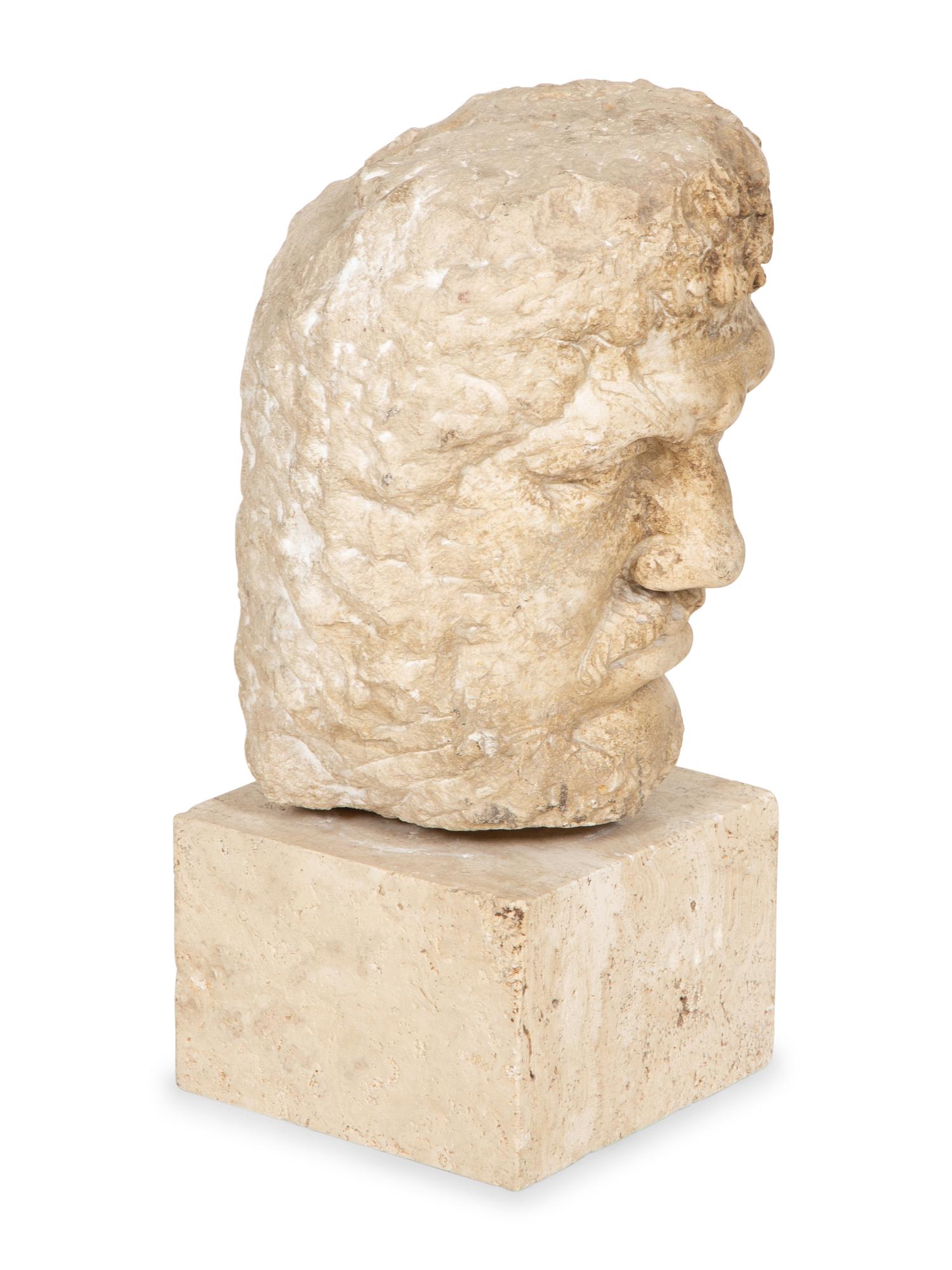 A Continental Carved Stone Head of a Man