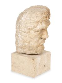 A Continental Carved Stone Head of a Man