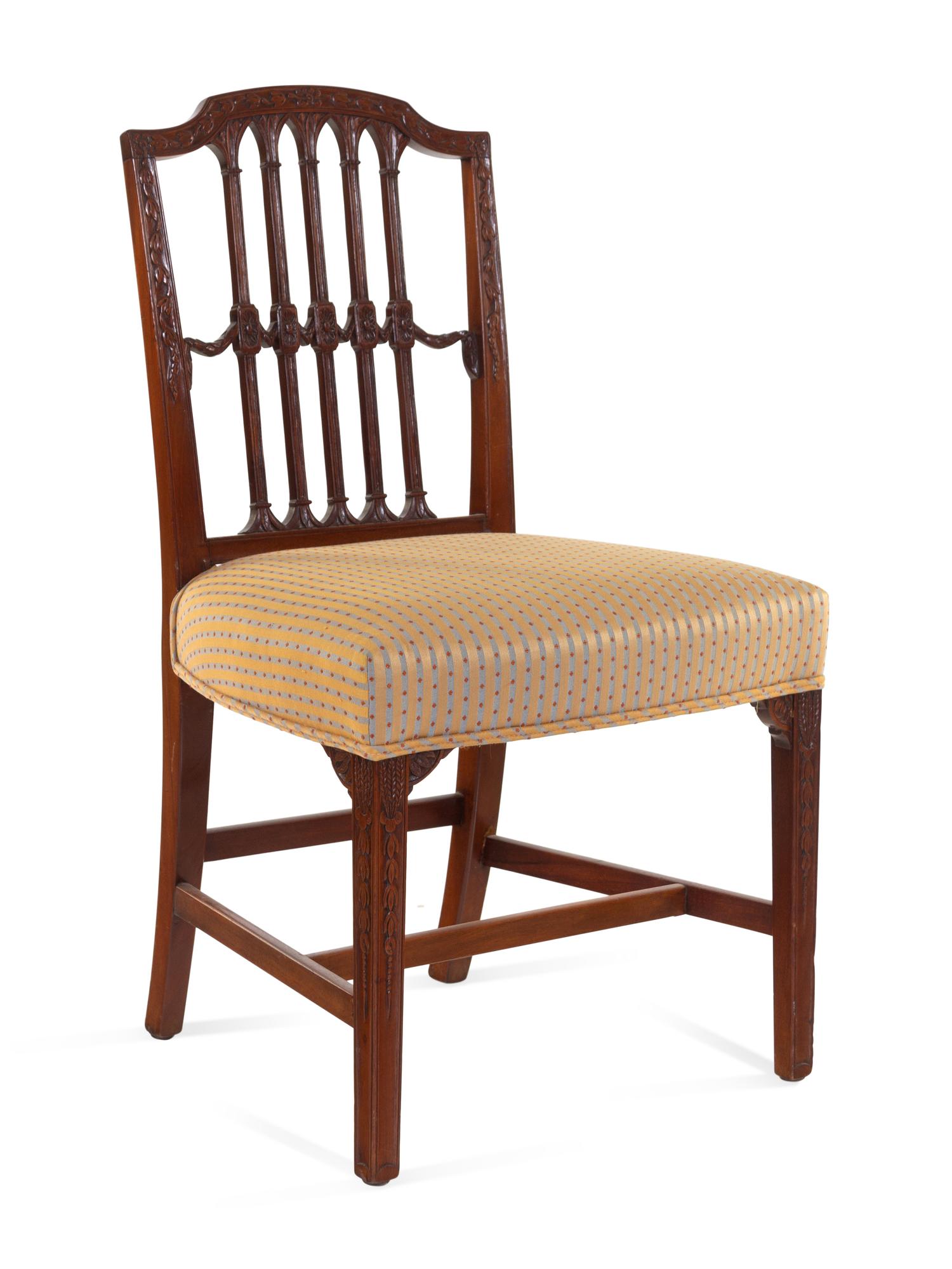 A Set of Six Regency Carved Mahogany Dining Chairs