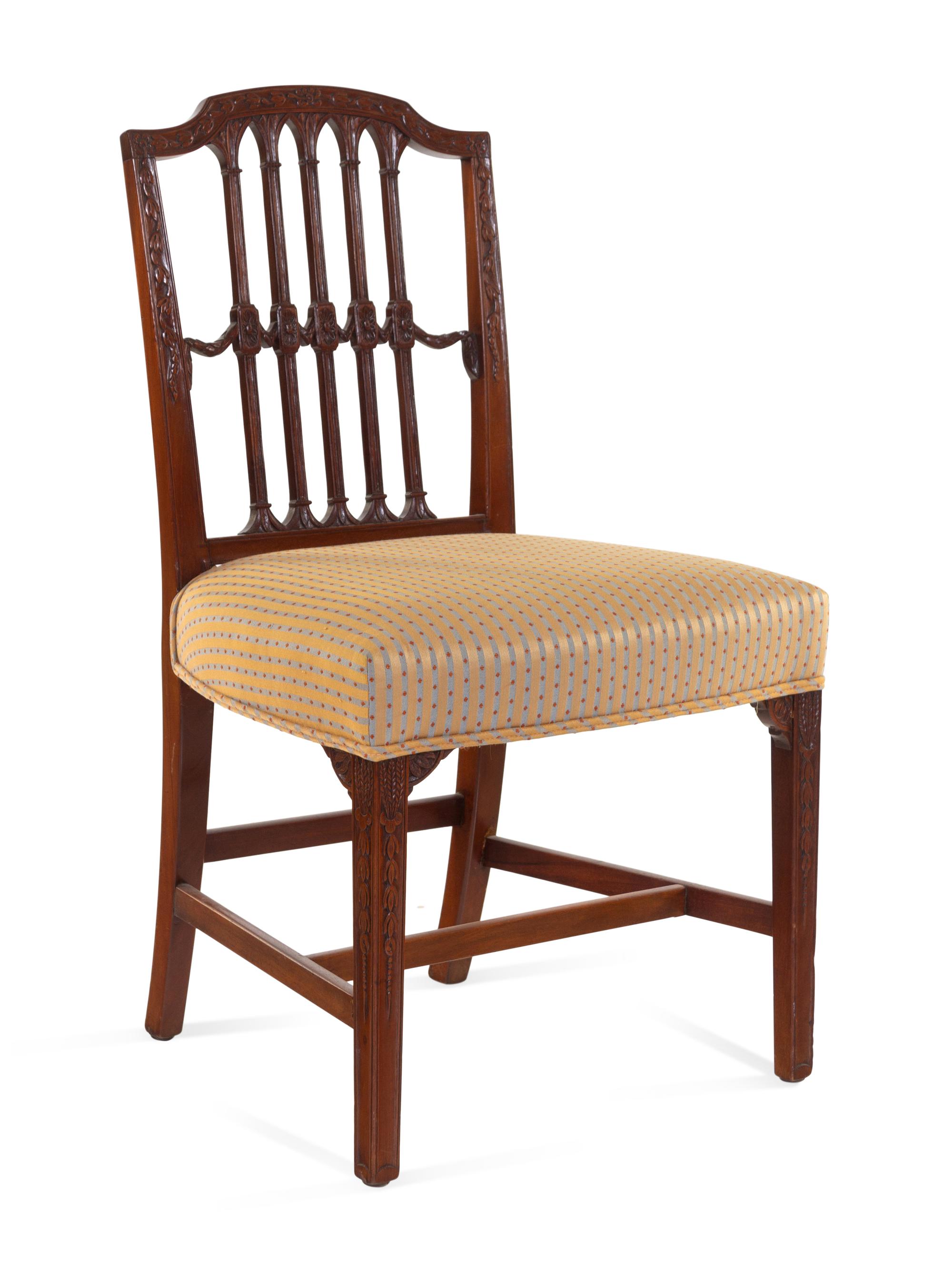 A Set of Six Regency Carved Mahogany Dining Chairs