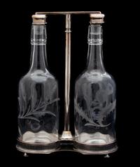 A Scottish Silver Plate Tantalus with Two Thistle Etched Bottles Height overall 12 inches. — 20TH CENTURY