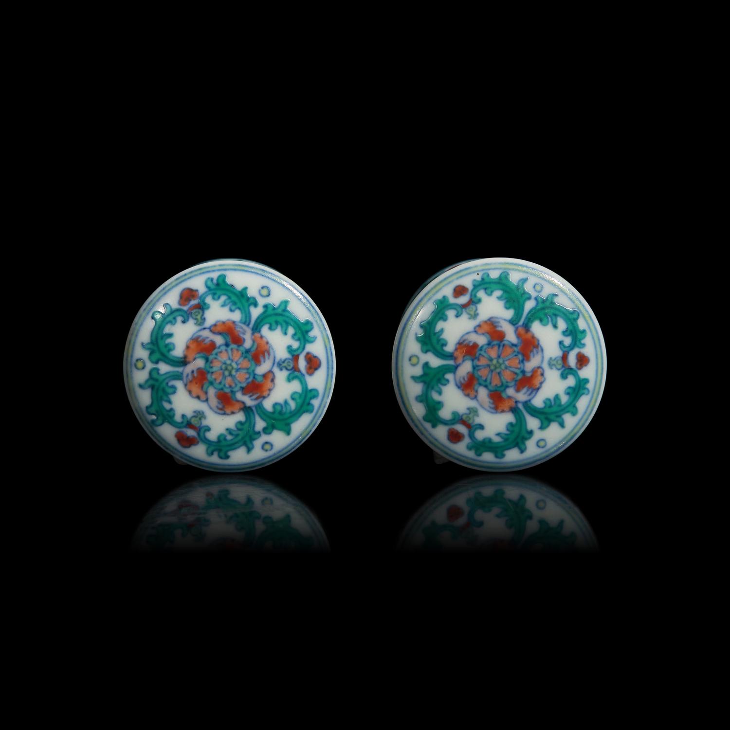 A Pair of Chinese Doucai Porcelain Scroll Caps 斗彩纏枝蓮紋軸頭