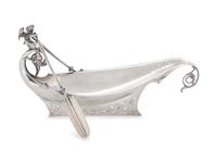 in the form of a boat surmounted with cherub with oars.