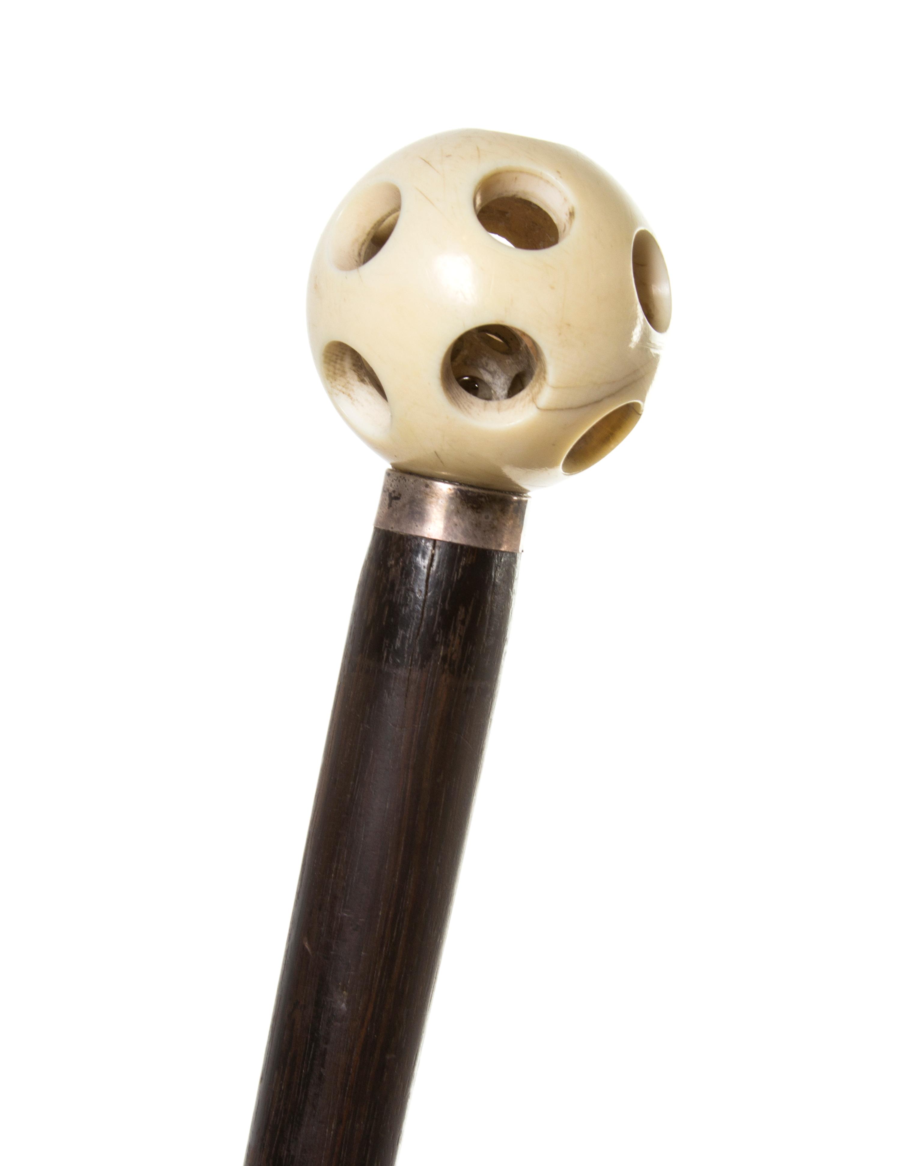 An Ivory and Ebonized Wood Walking Stick, Height overall 35 3/4 x diameter of handle 1 3/4 inches.