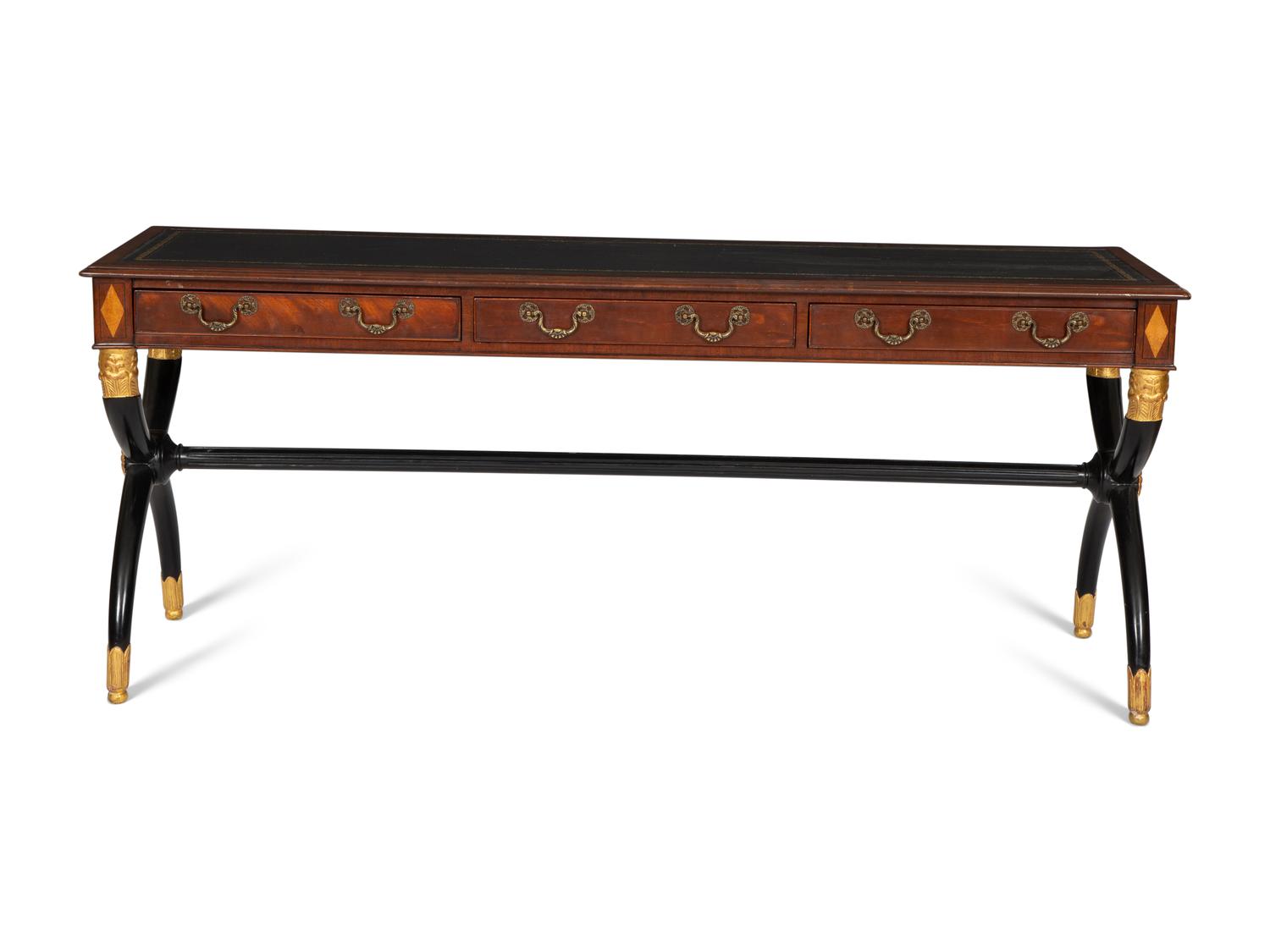 A Regency Style Parcel Gilt and Ebonized Mahogany Leather Top Console Table