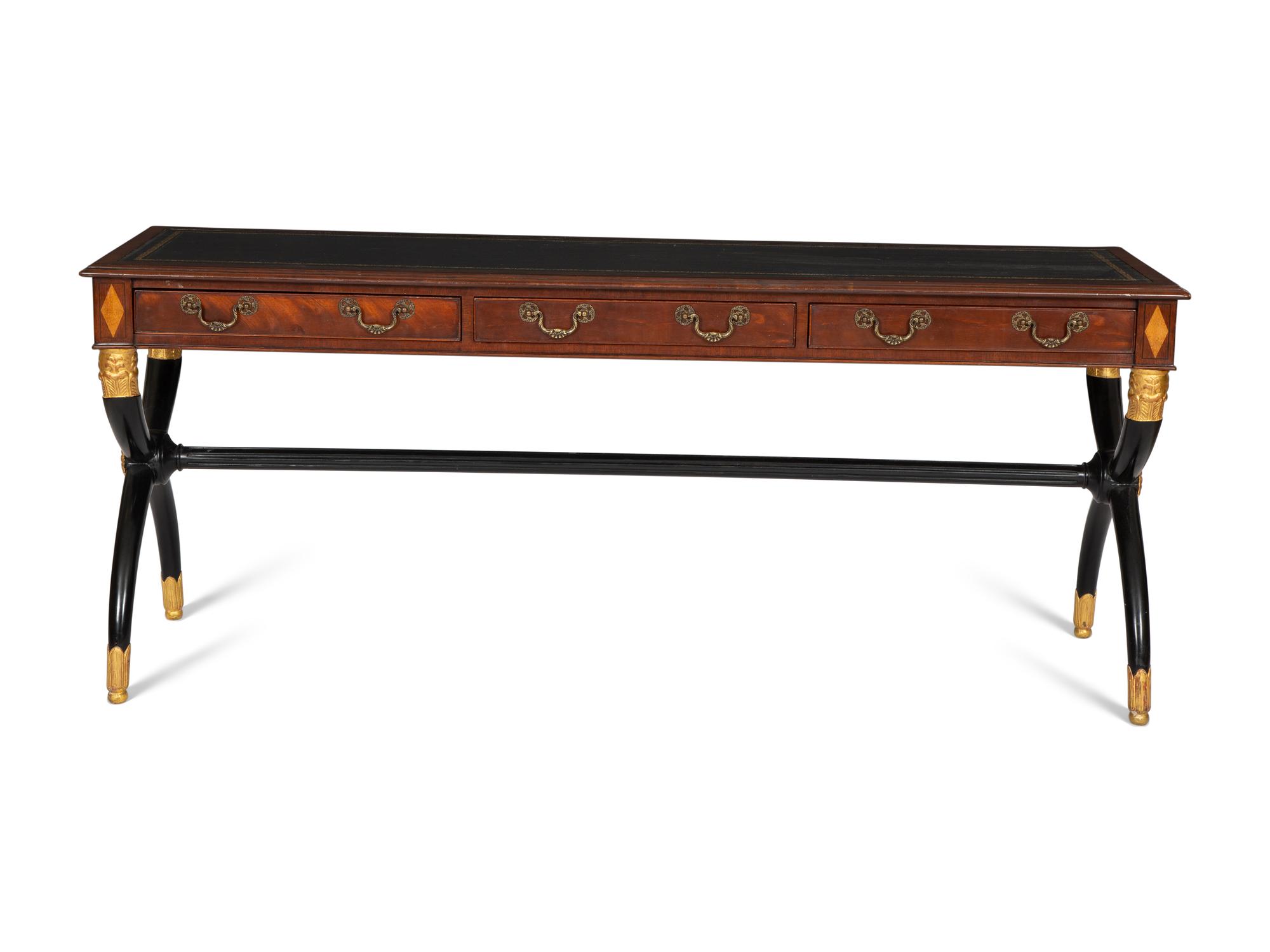 A Regency Style Parcel Gilt and Ebonized Mahogany Leather Top Console Table