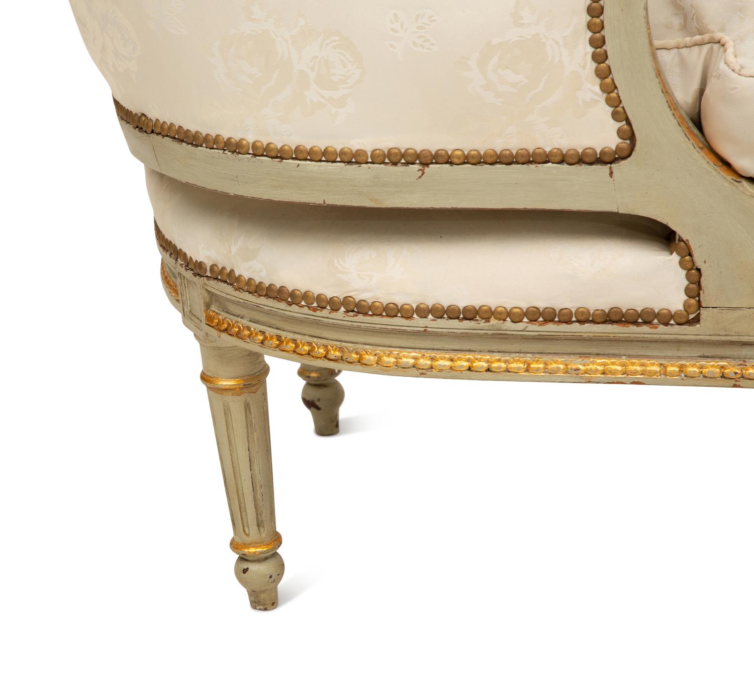 A French Provincial Style Painted and Parcel Gilt Chaise Longue