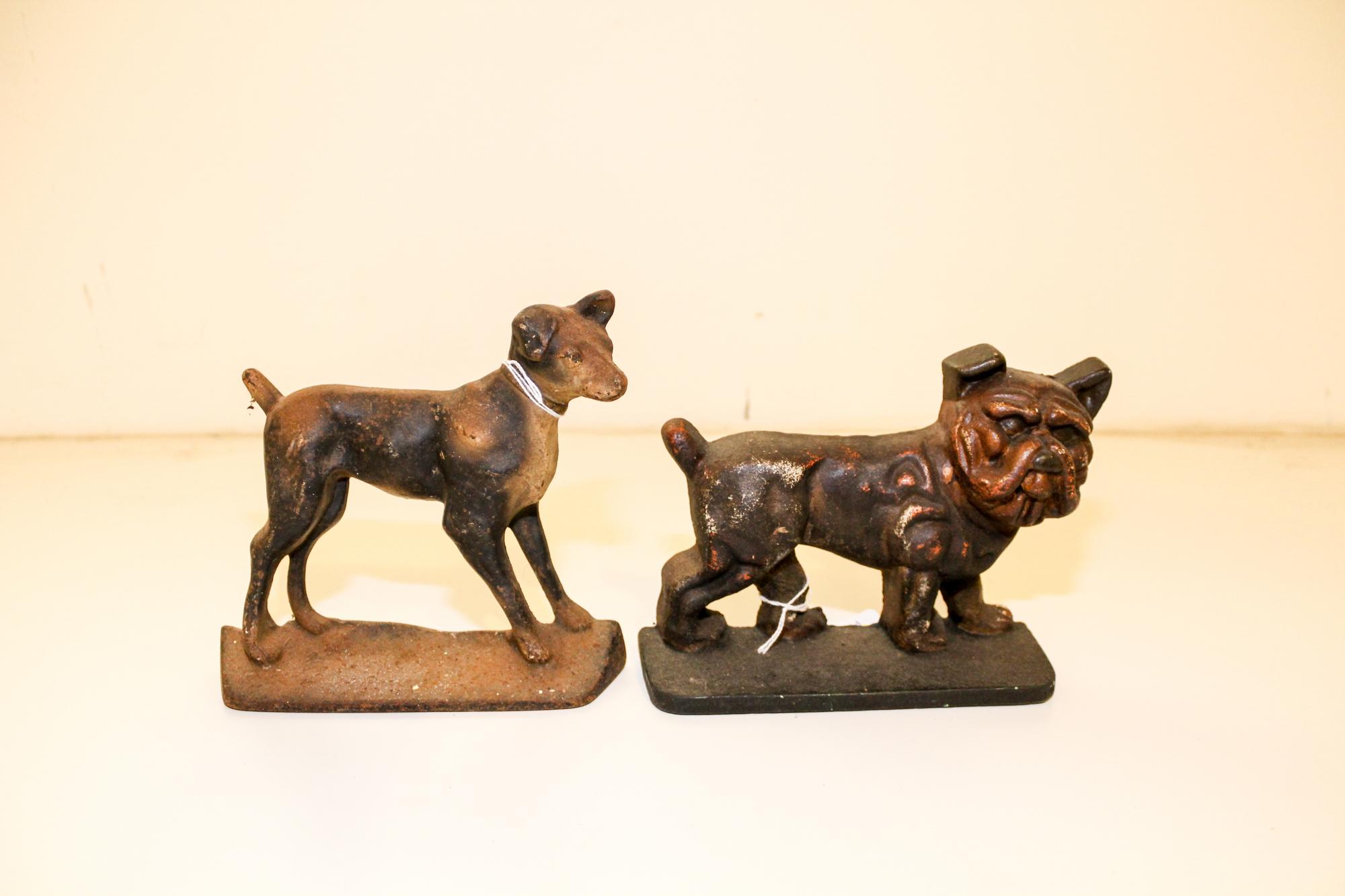 Two Cast Iron Doorstops Height of tallest 7 inches.