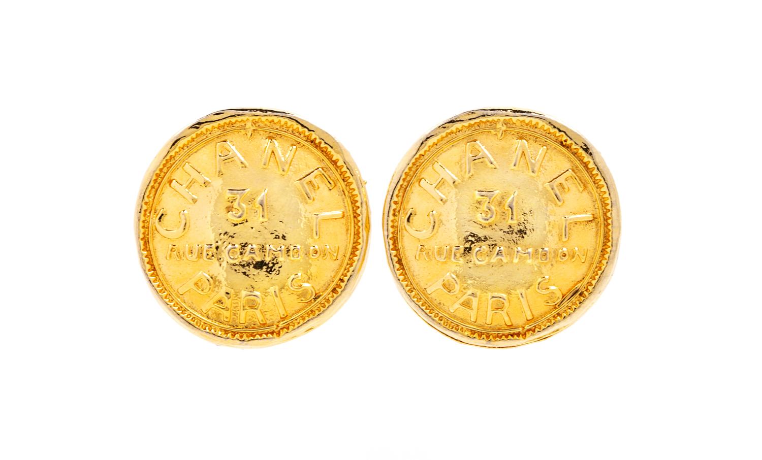 A Pair of Chanel Goldtone Coin Earclips, 1.25" diameter.