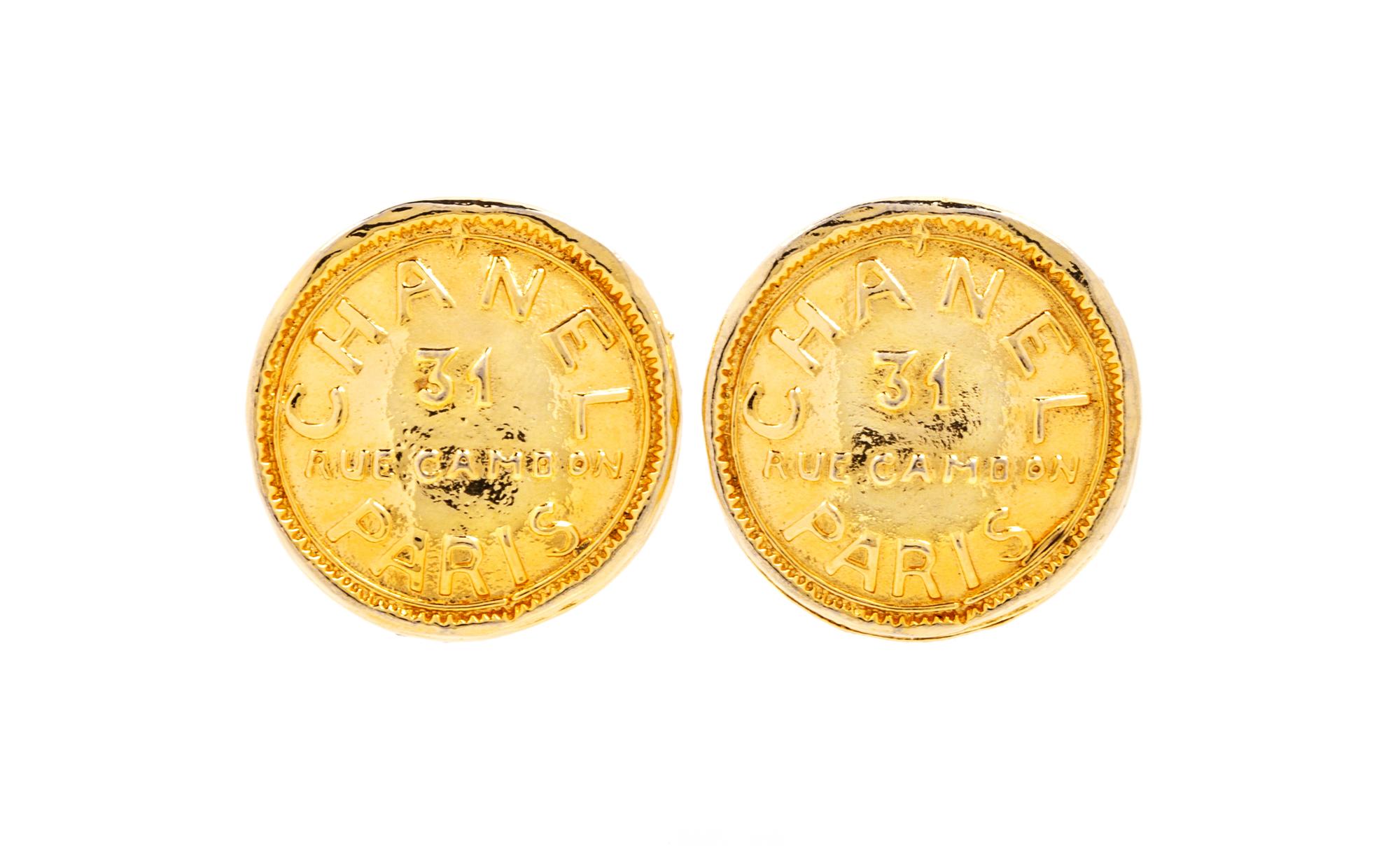 A Pair of Chanel Goldtone Coin Earclips, 1.25" diameter.