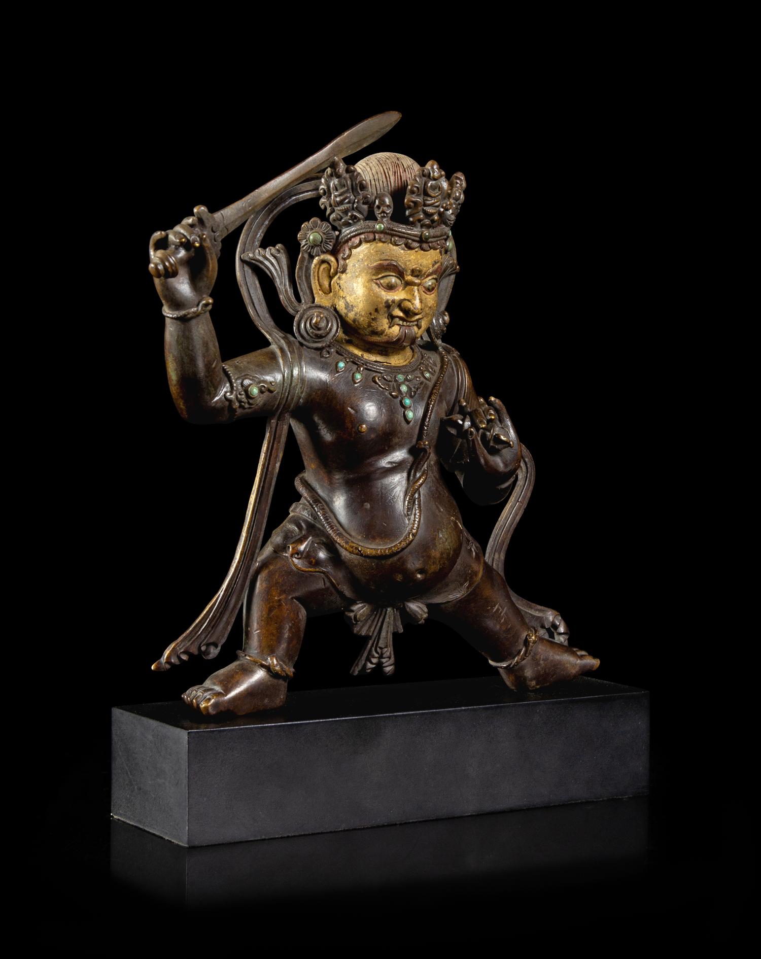 A Sino-Tibetan Parcel-Gilt Bronze Figure of Jambhala