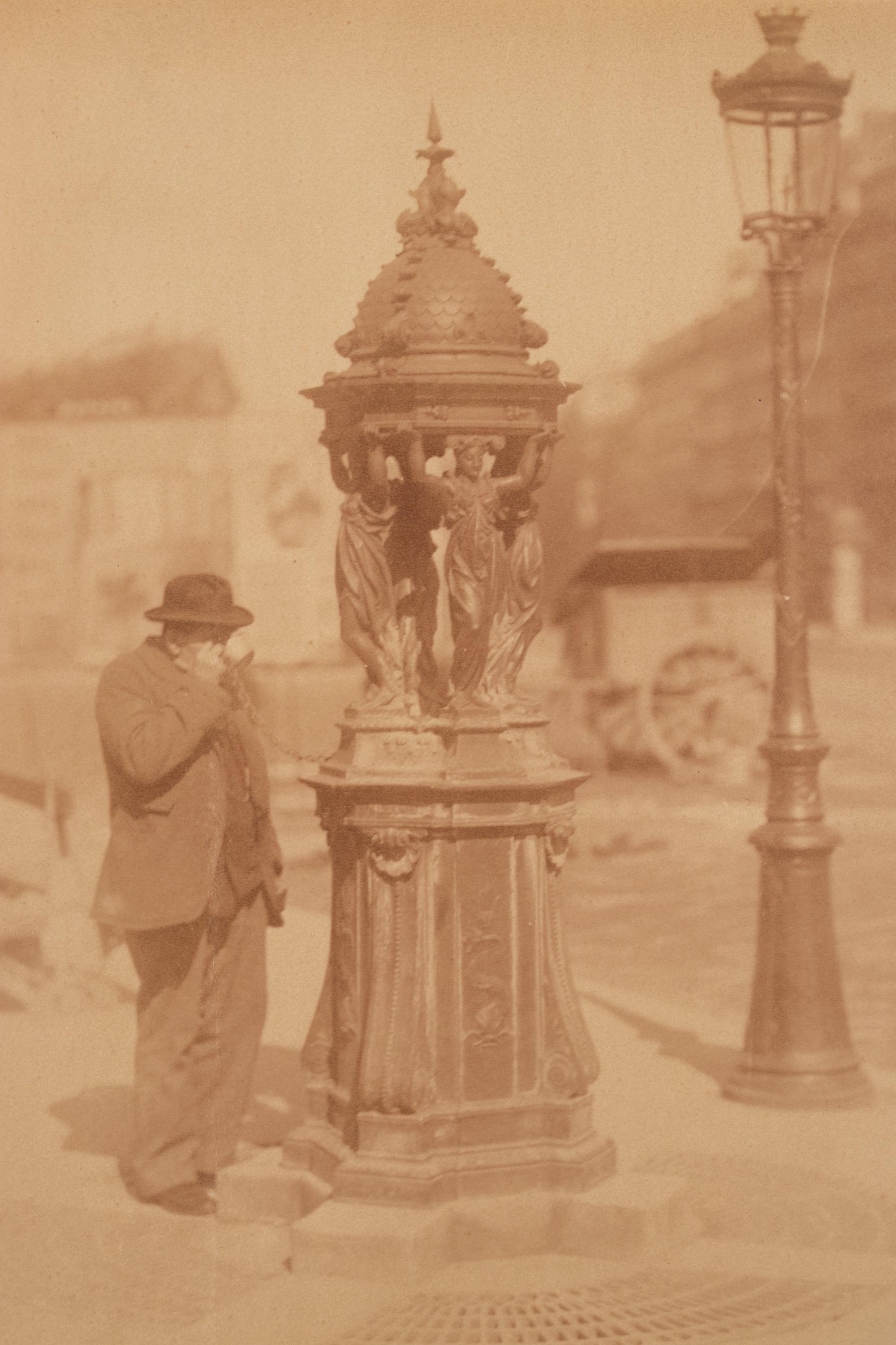 A group of four photographs ( Untitled [man at fountain], circa 1900s; Boutique empire, 14 rue de Grammont , 1903-1904; Hôtel de Neuville, rue Alphonse de Neuville, 1905-1906; Fontaine, faubourg Saint-Martin, 1912)