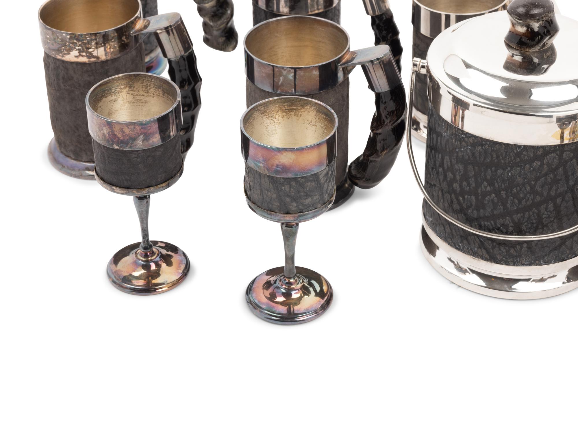 A Set of Silver-Plate and Hide Drinkware