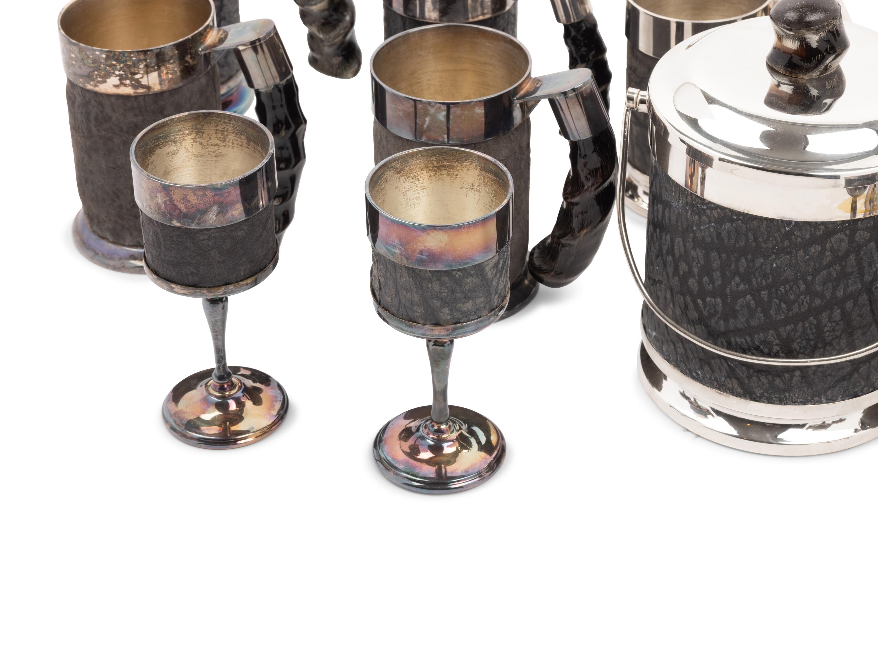 A Set of Silver-Plate and Hide Drinkware