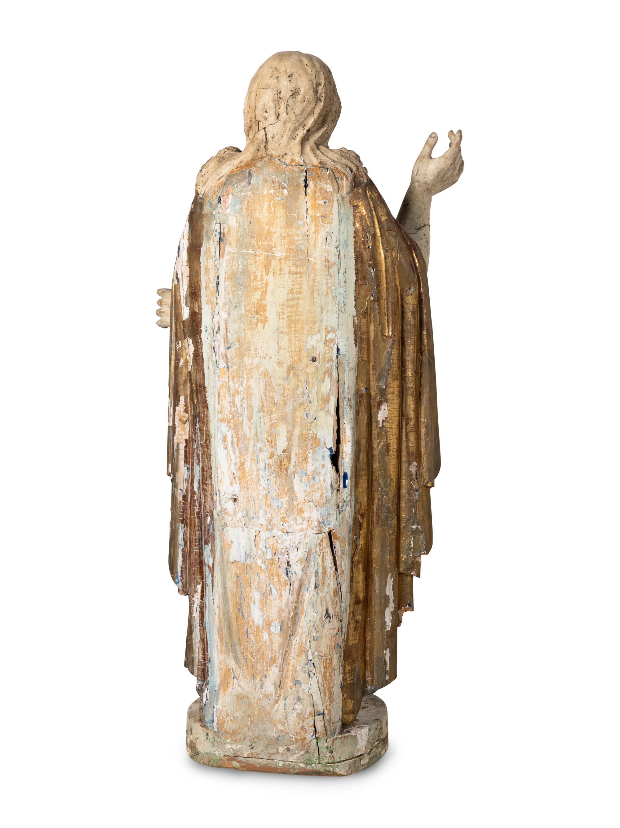 A Continental Painted and Parcel Giltwood Figure