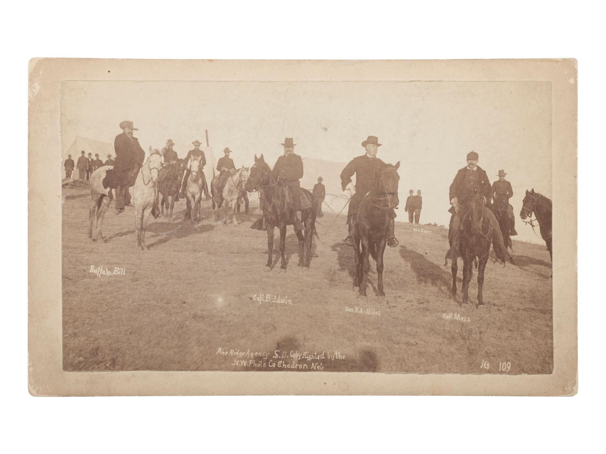 [LATE INDIAN WARS]. TRAGER & FORD, photographers. Boudoir photograph of General Nelson Miles and Buffalo Bill Cody at Wounded Knee. Chadron, Nebraska: Northwestern Photographic Co., January 1891.