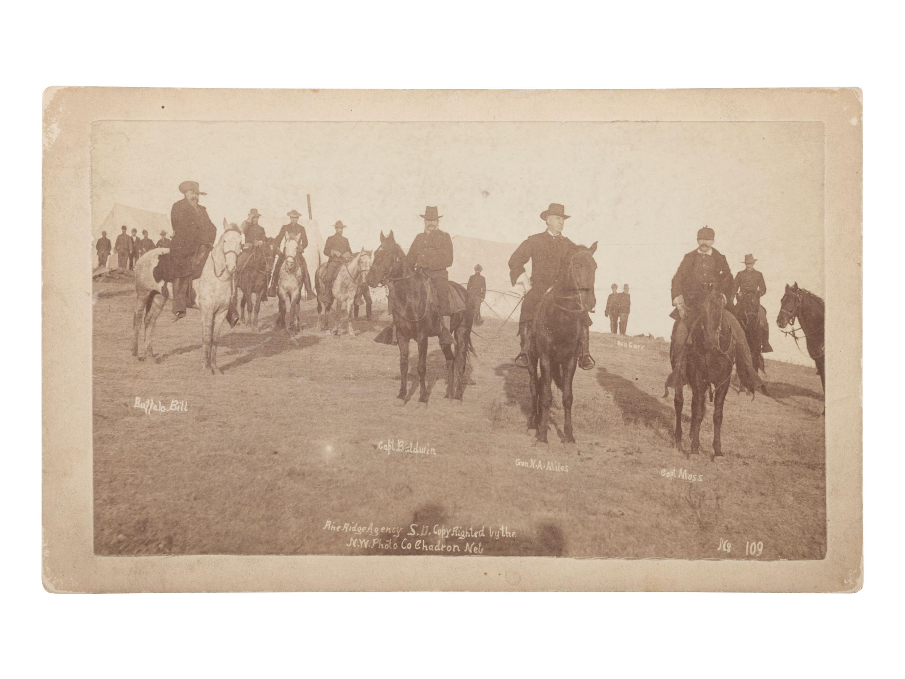 [LATE INDIAN WARS]. TRAGER & FORD, photographers. Boudoir photograph of General Nelson Miles and Buffalo Bill Cody at Wounded Knee. Chadron, Nebraska: Northwestern Photographic Co., January 1891.