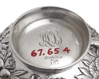 A Six-Piece Sterling Silver Floral Repousse Tea and Coffee Service