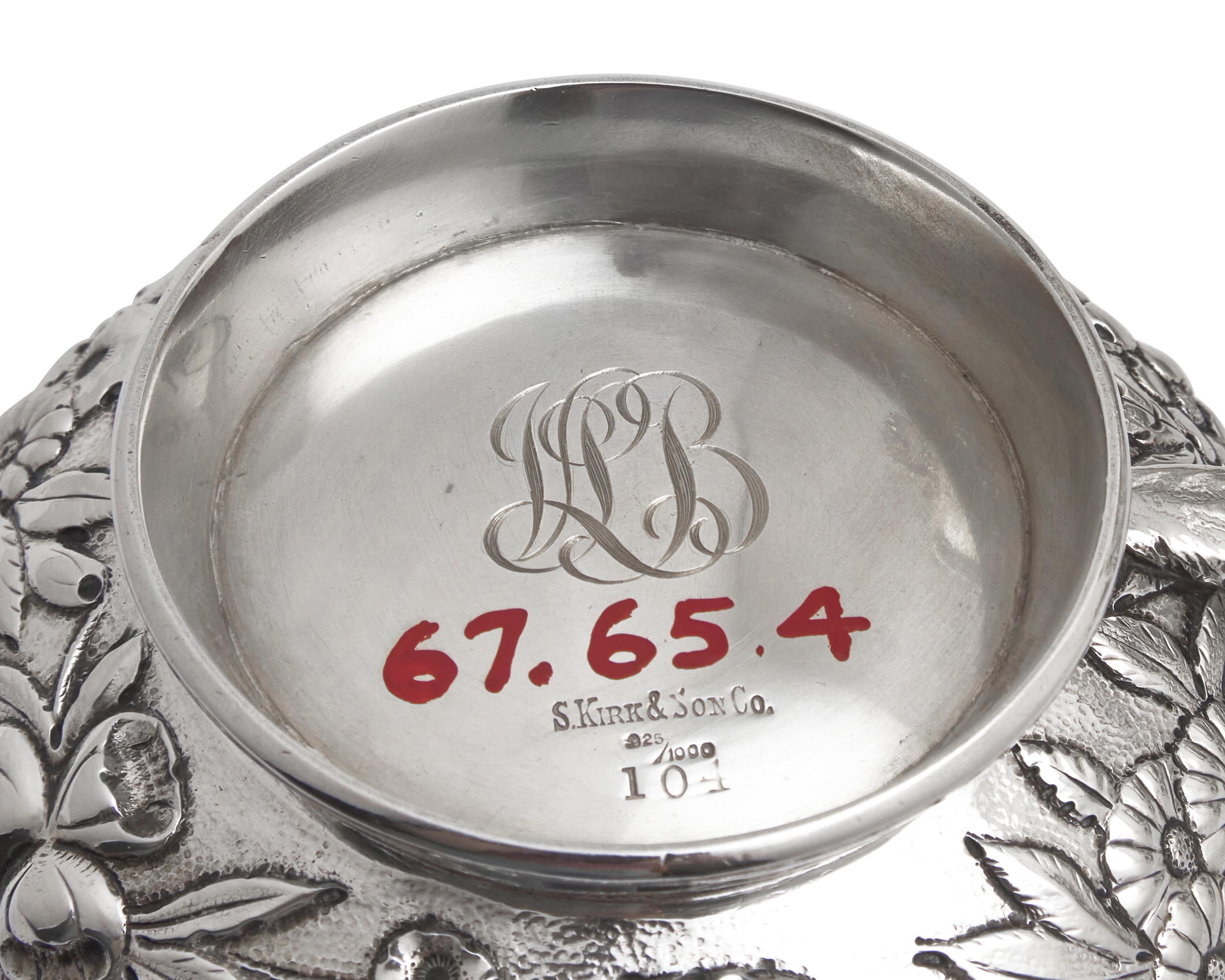A Six-Piece Sterling Silver Floral Repousse Tea and Coffee Service