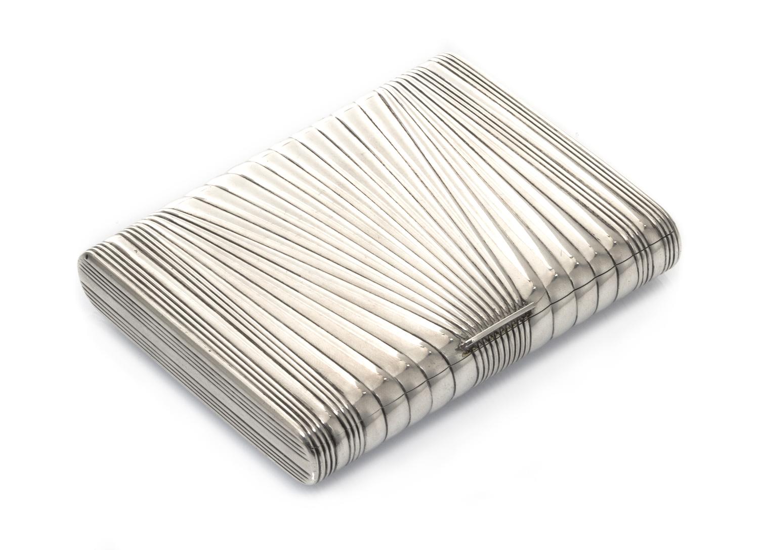 A Russian Silver Cigarette Case, Mark of Ivan Kurtikov, St. Petersburg, early 20th century, the case having diagonal reeded decoration