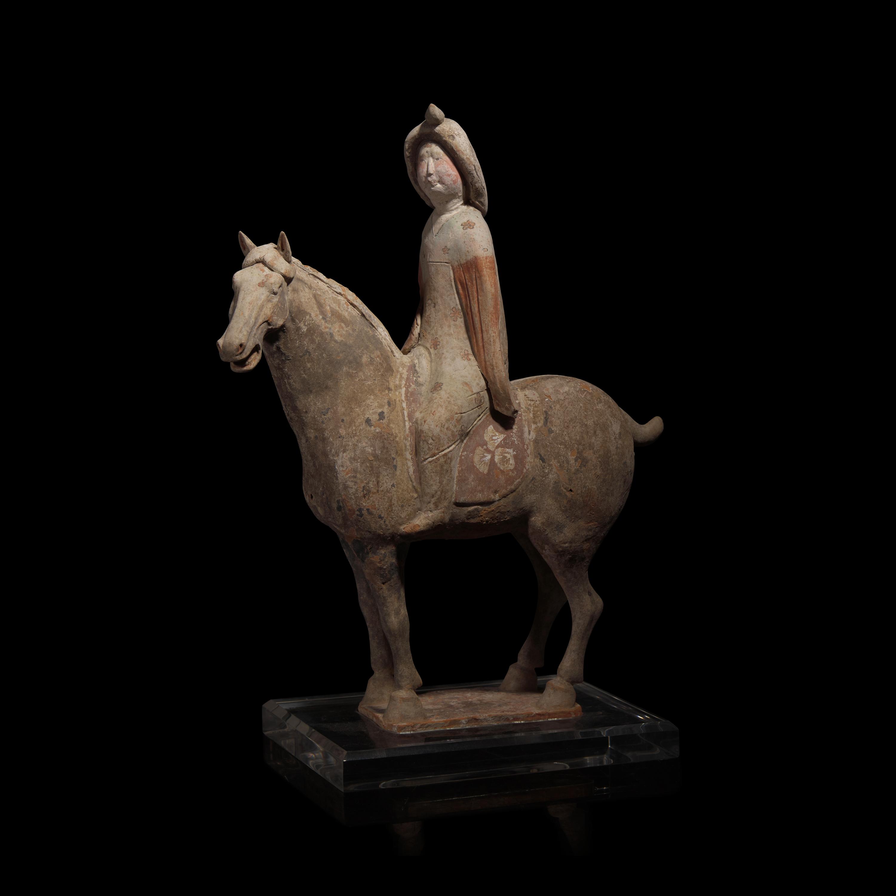A Chinese Painted Pottery Female Equestrian Figure, Tang Dynasty — 唐 陶加彩女騎馬俑