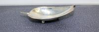 An American Silver Dish, Alfredo Sciarrotta, Providence, RI, modeled in the form of a tobacco leaf and raised on three ball feet.