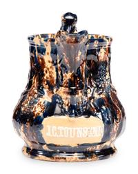 A Large Yellowware Pitcher with Spectacular Blue Flint Enamel Glaze