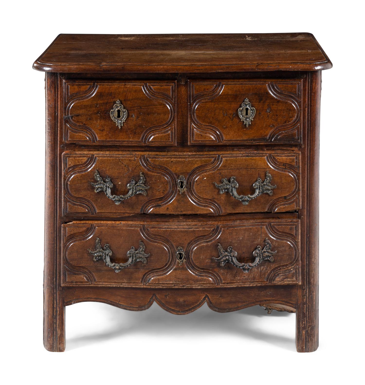 A Louis XV/XVI Provincial Walnut Chest of Drawers