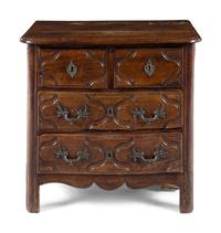 A Louis XV/XVI Provincial Walnut Chest of Drawers
