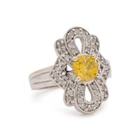 WHITE GOLD, TREATED YELLOW DIAMOND AND DIAMOND RING